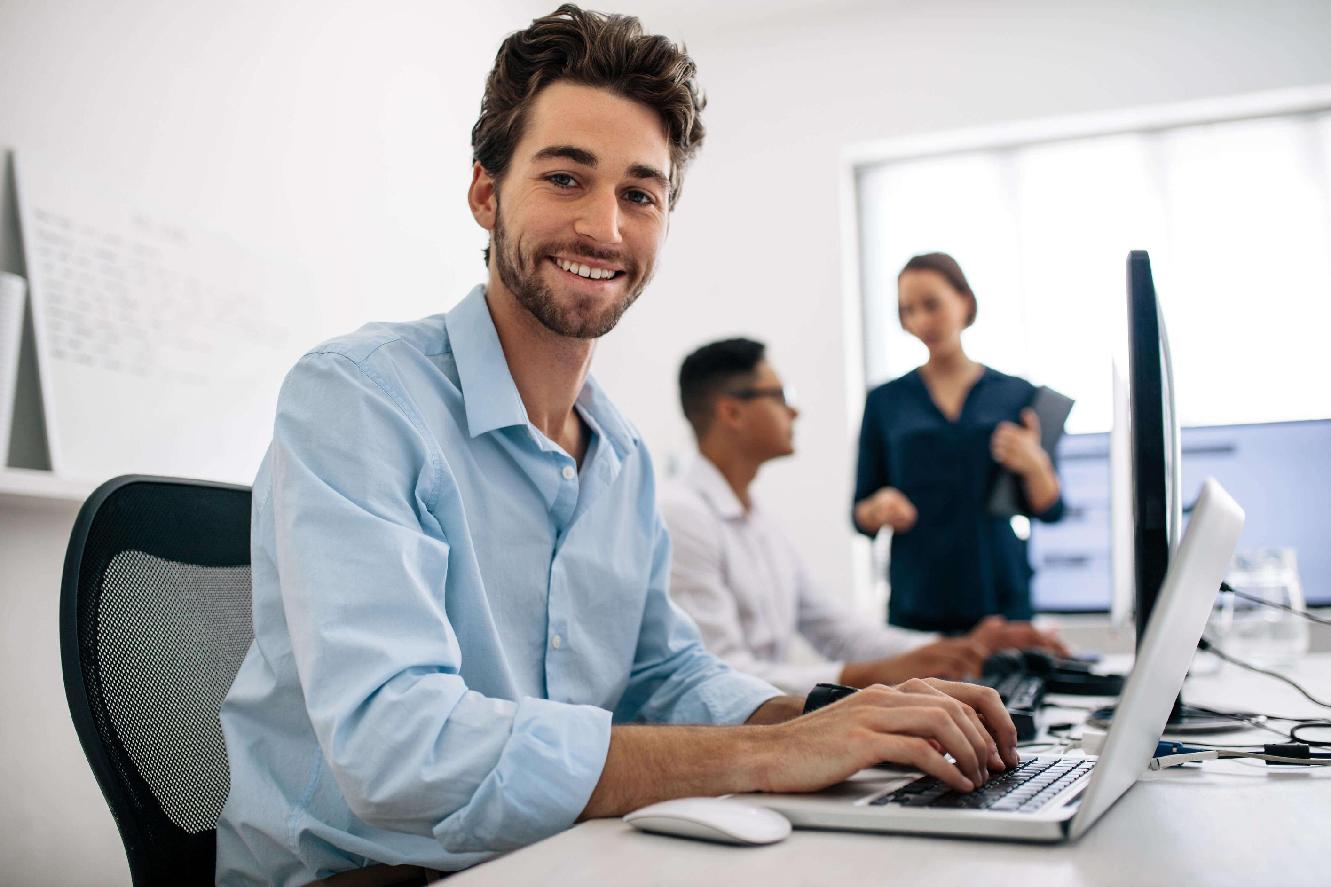 Man in shirt typing on a keyboard